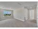 Large bonus room with a window and access to bathroom at 3019 Tackle Dr, Leesburg, FL 34748