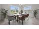 Bright dining room with a marble table and modern chairs at 3019 Tackle Dr, Leesburg, FL 34748