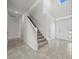Bright entryway with tiled floor and staircase at 3019 Tackle Dr, Leesburg, FL 34748