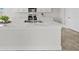 Modern kitchen with white cabinets and marble countertops at 3019 Tackle Dr, Leesburg, FL 34748