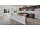 Modern kitchen with granite countertops and dark cabinets at 3019 Tackle Dr, Leesburg, FL 34748