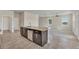 Kitchen island with granite countertops and stainless steel appliances at 3019 Tackle Dr, Leesburg, FL 34748