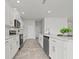 Modern kitchen with white cabinets and stainless steel appliances at 3019 Tackle Dr, Leesburg, FL 34748