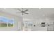 Open concept kitchen with white cabinets and island at 3019 Tackle Dr, Leesburg, FL 34748