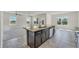 Kitchen with island, granite countertops, and stainless steel appliances at 3019 Tackle Dr, Leesburg, FL 34748