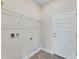 Bright laundry room with built-in shelving and storage at 3019 Tackle Dr, Leesburg, FL 34748
