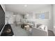 Spacious living room with comfortable seating area and natural light at 3019 Tackle Dr, Leesburg, FL 34748