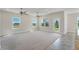 Spacious living room with carpet and large windows at 3019 Tackle Dr, Leesburg, FL 34748