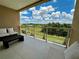 Private balcony with outdoor furniture and scenic view at 3185 Brasilia Ave, Kissimmee, FL 34747