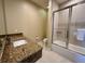 Bathroom with granite vanity, shower/tub combo, and tile flooring at 3185 Brasilia Ave, Kissimmee, FL 34747
