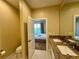 Guest bathroom with toilet and double vanity at 3185 Brasilia Ave, Kissimmee, FL 34747