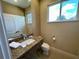 Clean bathroom with granite countertop, single sink, and toilet at 3185 Brasilia Ave, Kissimmee, FL 34747