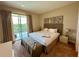 Spacious bedroom with king-size bed and private balcony access at 3185 Brasilia Ave, Kissimmee, FL 34747