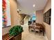 Bright dining area with wooden table and chairs, view into kitchen and living room at 3185 Brasilia Ave, Kissimmee, FL 34747