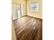 Bright bedroom with wood-look flooring and sliding closet doors at 322 N 6Th St, Haines City, FL 33844