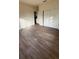 Spacious bedroom featuring wood-look floors and an adjacent room at 322 N 6Th St, Haines City, FL 33844