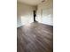 Spacious bedroom featuring wood-look floors and an adjacent room at 322 N 6Th St, Haines City, FL 33844