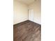 Bright bedroom with wood-look floors and double door closet at 322 N 6Th St, Haines City, FL 33844