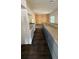 Open concept kitchen with a long granite countertop island at 322 N 6Th St, Haines City, FL 33844