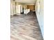Open floor plan living room and kitchen with wood-look flooring at 322 N 6Th St, Haines City, FL 33844