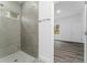 Large walk-in shower with gray tile and window at 6264 Sw 144Th Pl, Ocala, FL 34473