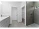Modern bathroom with walk-in shower and double vanity at 6264 Sw 144Th Pl, Ocala, FL 34473