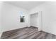 Simple bedroom with closet and wood-look flooring at 6264 Sw 144Th Pl, Ocala, FL 34473