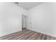 Simple bedroom with wood-look flooring and access to bathroom at 6264 Sw 144Th Pl, Ocala, FL 34473