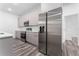 Modern kitchen with stainless steel appliances and gray cabinets at 6264 Sw 144Th Pl, Ocala, FL 34473