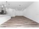 Open living area with wood-look floors and kitchen views at 6264 Sw 144Th Pl, Ocala, FL 34473