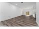 Bright living room featuring wood-look flooring and sliding doors at 6264 Sw 144Th Pl, Ocala, FL 34473