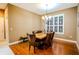 Elegant dining room with wood table and brown leather chairs at 6408 Shoreline Ct, St Cloud, FL 34771