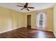 Bright bedroom with wood flooring, ceiling fan, and ample closet space at 814 Crest Pines Dr # 928, Orlando, FL 32828