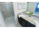 Bathroom with a shower and double vanity at 8956 Zurich Ln, Kissimmee, FL 34747