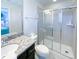 Bathroom with granite vanity, shower, and toilet at 8956 Zurich Ln, Kissimmee, FL 34747