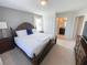 King-size bed in spacious bedroom with ensuite bathroom at 8956 Zurich Ln, Kissimmee, FL 34747