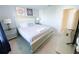King-size bed in a spacious bedroom with gray walls at 8956 Zurich Ln, Kissimmee, FL 34747