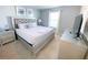 King-size bed in a bedroom with tufted headboard at 8956 Zurich Ln, Kissimmee, FL 34747