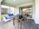Covered patio with seating and dining area at 8956 Zurich Ln, Kissimmee, FL 34747