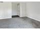 Bright entryway with gray carpeting and door to exterior at 152 Springwood Cir # B, Longwood, FL 32750