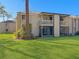 Condo building with screened patio and grassy backyard at 152 Springwood Cir # B, Longwood, FL 32750
