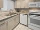 Modern kitchen with granite countertops and stainless steel appliances at 152 Springwood Cir # B, Longwood, FL 32750