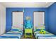 Fun ' bedroom with twin beds and themed decor at 1627 Kona Ln, Davenport, FL 33897
