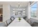 Modern dining room with a large table and statement lighting at 1627 Kona Ln, Davenport, FL 33897