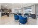 Open living room and kitchen with modern decor and blue accents at 1627 Kona Ln, Davenport, FL 33897