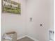 Bright laundry room with a hamper and space for washer and dryer at 218 Amberwood Way, Umatilla, FL 32784
