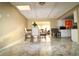 Bright dining area with kitchen and living room views, and tile flooring at 2214 Winnetka Ct, Orlando, FL 32818