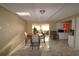 Bright dining area with kitchen and living room views, and tile flooring at 2214 Winnetka Ct, Orlando, FL 32818