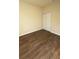 Spacious bedroom with wood-look flooring and mirrored closet doors at 314 N 6Th St, Haines City, FL 33844