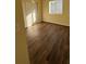 Well-lit bedroom with hardwood floors and double door closet at 314 N 6Th St, Haines City, FL 33844